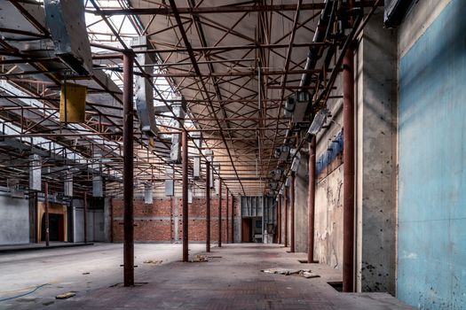 The abandoned industrial building. Fantasy interior scene. Shot in an abandoned ruin.