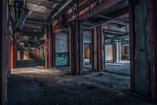 The abandoned industrial building. Fantasy interior scene. Shot in an abandoned ruin.