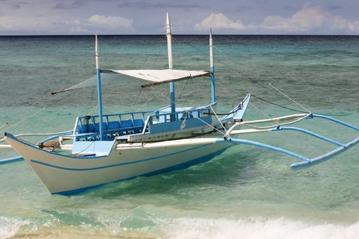 Small boat moored at seaside. Boracay. Philippines