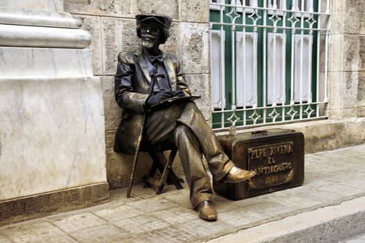 Havana, Cuba - January 11, 2019: Bronze painted artist on a city street. Havana, Cuba
