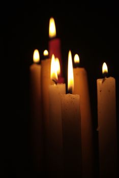 Candles flame close up on a black background