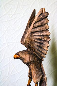 Beautiful wooden figure of an eagle on a white background
