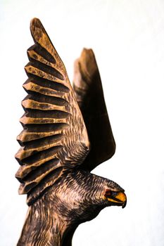 Beautiful wooden figure of an eagle on a white background