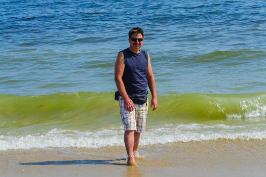 Portrait of a attractive senior man at a beach