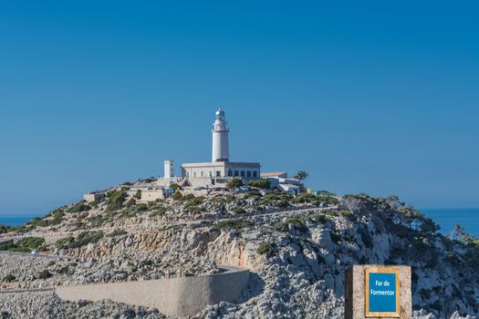 Road sign with inscription in Spanish "Far de Formentor" just before the
Lighthouse Formentor, Mallorca, Balearic Island, Spain.