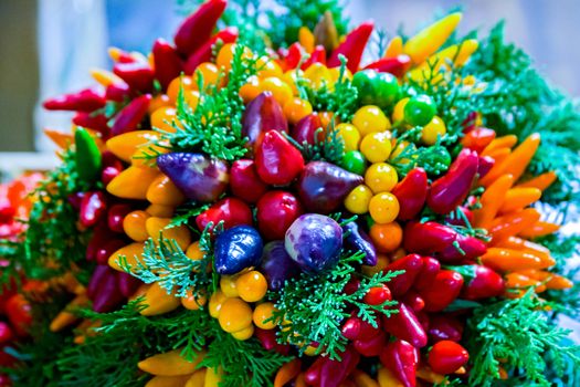 Beautiful decorative colorful bouquet with small pepper. Multicolor ristra Chilli Peppers for Sale at the Local Farmers Market.