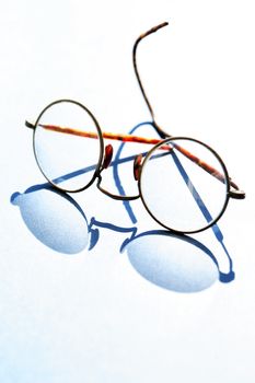 Old spectacles with shadow against sun light