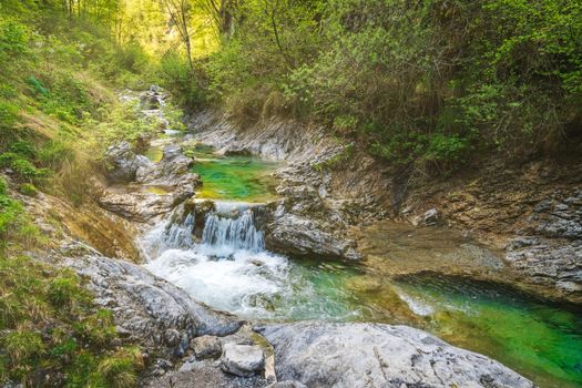 Tiny waterfall at the Val Vertova Torrent near Bergamo,Seriana Valley,Italy,