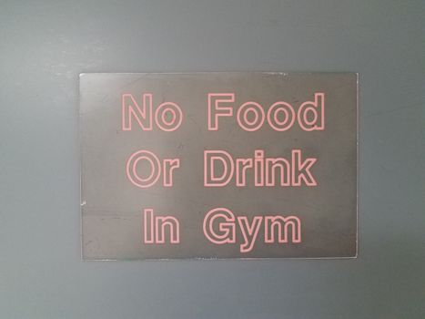 black no food or drink in the gym with red text on black wall