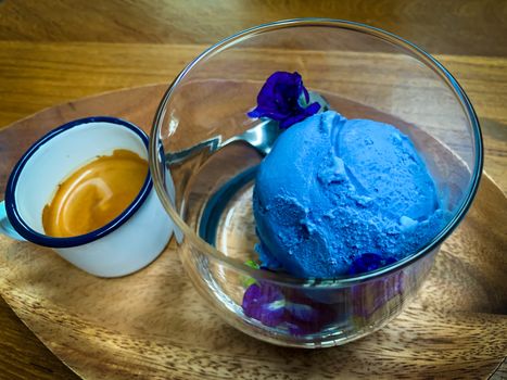 Blue ice cream in a clear glass with ready-to-eat coffee