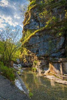 Wonderful view of the Vertova torrent at sunset, in the middle of the Orobiche mountains with its beautiful tiny waterfalls.