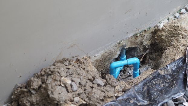Fixing leaking water pipe underground the house by plumber which finding leaked point and take out broken piece and maintenance by apply special glue to connect old with new blue pip line 