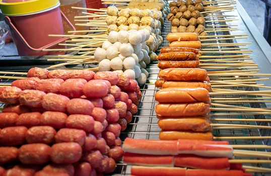 Various Types of Asian Sausages, Meat Balls and Fish Balls on Skewers.