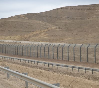fence in the desert of south israel for protection of the land