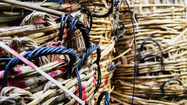 Stack of big wicker baskets in market