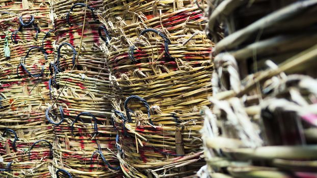 Stack of big wicker baskets in market
