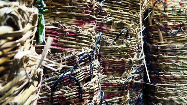 Stack of big wicker baskets in market
