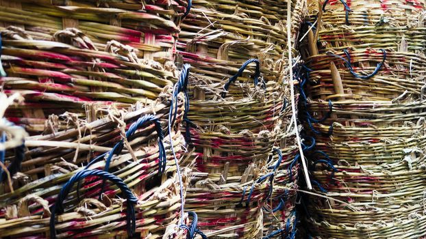 Stack of big wicker baskets in market