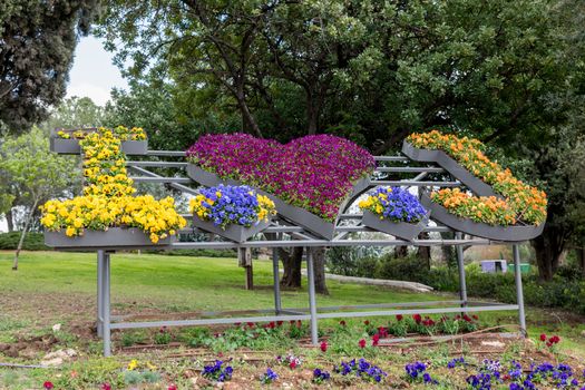 flower compositon in a park in jeruselem with the text I love jerusalem
