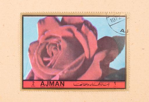 UNITED ARAB EMIRATES - CIRCA 1972: A stamp printed in the United Arab Emirates shows a tulip, circa 1972