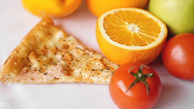 Pizza with fresh fruits and vegetables on white background