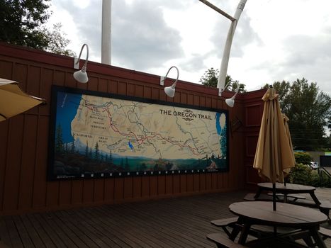 large map of Oregon and the Oregon trail with table and umbrella