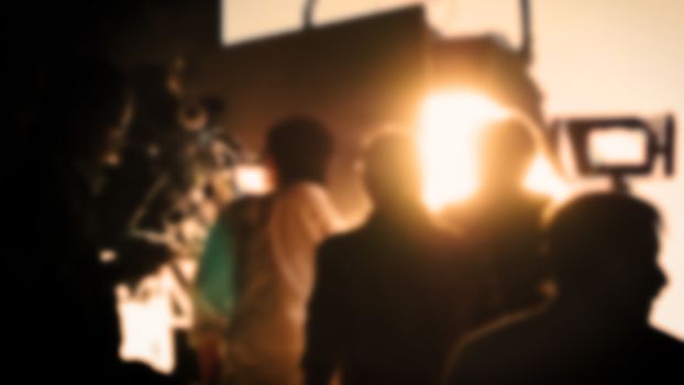 Blurry images of studio video shooting behind the scene or b-roll for online commercial and tvc which done by professional movie director film crew team and camera equipment with lighting set