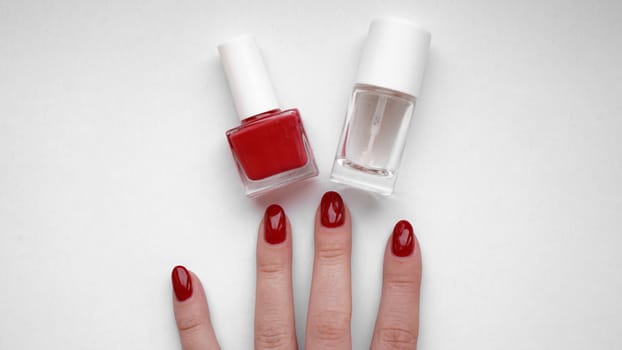 Beautiful female hands. Hand skin care. Beautiful Woman Hands With Red Manicure. Red nail polish and Cuticle oil.