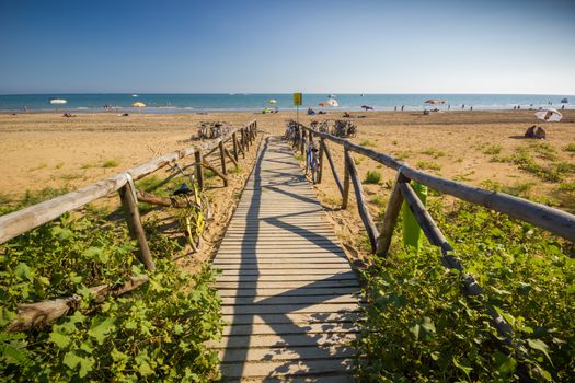 Nice wooden road to beach, sunny day, nice blue sky