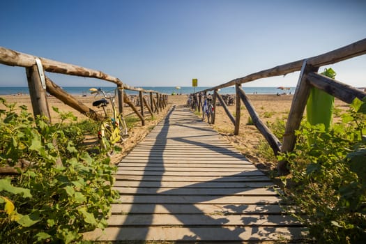 Nice wooden road to beach, sunny day, nice blue sky