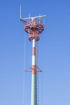 Tall antenna tower with nice blue sky