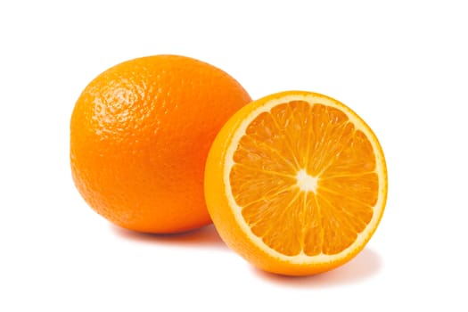 Fresh oranges, one whole and one half isolated on white background with shadow.