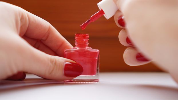 Manicure - Beautiful manicured womans nails with red nail polish