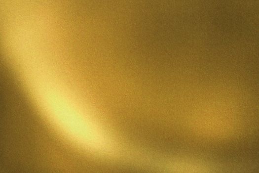 Light shining on gold brushed metal wall, abstract texture background