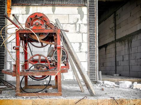 Worn Out Hand Operated Electrical Steel Cutter at a Construction Site