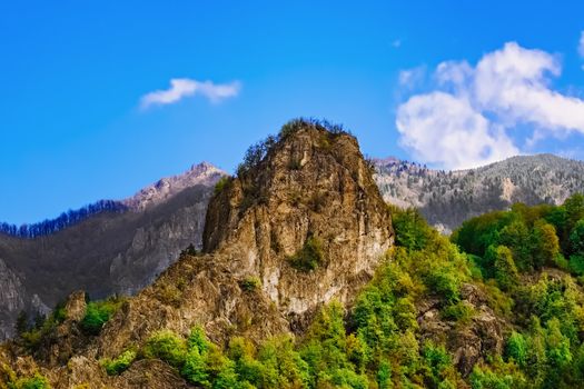 Carpathian mountains under blue sky in Romania