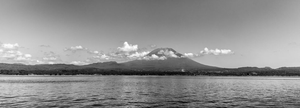 Agung volcano view from the sea. Bali island, Indonesia. Black and white image.