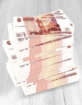 Russian money Placed on a dollar pile on a striped wood floor.(with Clipping Path).