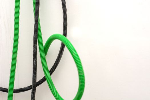 Black and green corrugated bellow conduit tube for electrical wiring