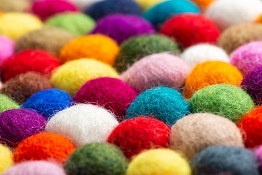 Multicolored felt ball rug detail, colorful texture