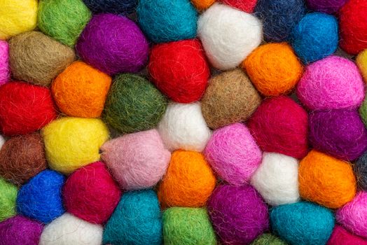 Multicolored felt ball rug detail, colorful texture