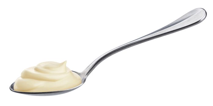 Sour cream in spoon isolated on white background with clipping path