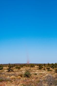 Landspout whirlwind sand tornado dust devil in Australian dessert
