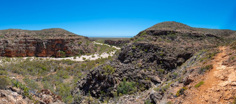 Mandu Mandu Gorge panorama dry river bed leading into Indian Ocean at Cape Range National Park Australia