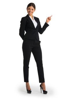 Businesswoman pointing with finger at empty copy space, studio isolated on white background, full length portrait