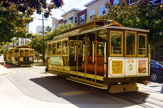 SAN FRANCISCO, CA, USA - AUGUST 17, 2013: Passengers ride in a cable car on August 17, 2013 in San Francisco. It is the most popular way to get around the City of San Fransisco which is in service since 1873.