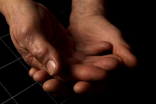 cropped view of people stacking hands during group therapy session in italy