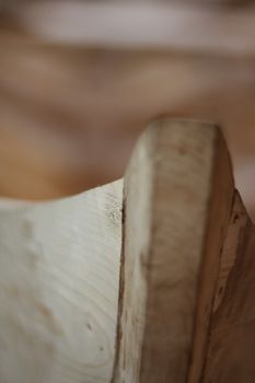 Handmade wooden boat in the barn close up view