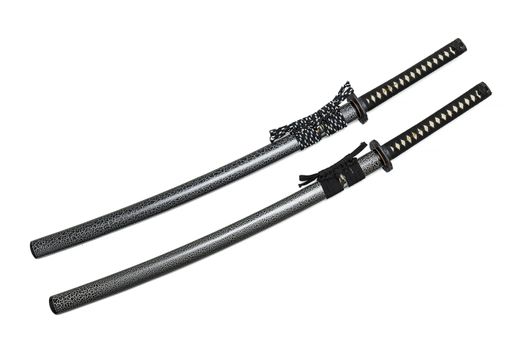 2 Japanese swords and scabbard with black and two-tone cord isolated in white background.