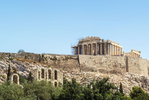 The Acropolis of Athens is an ancient citadel located on a high rocky outcrop above the city of Athens and containing the remains of several ancient buildings of great architectural and historic significance,